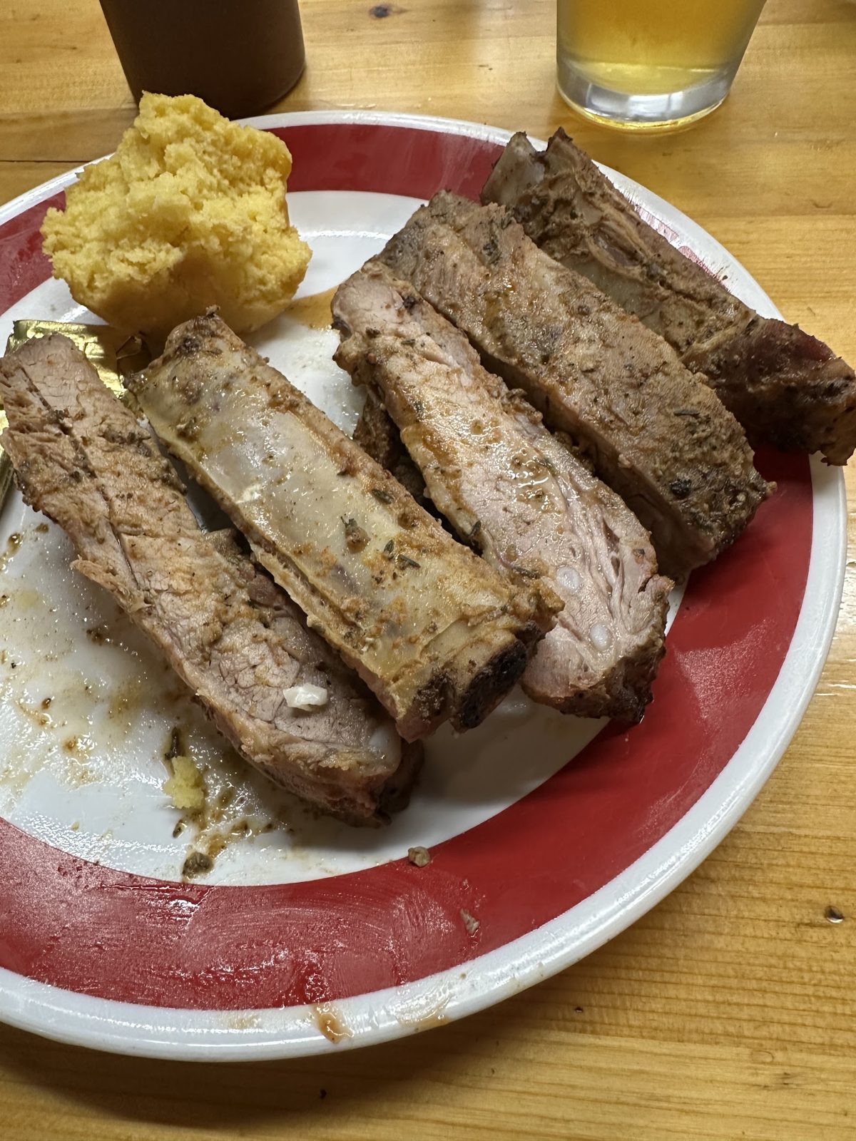 Plate of smoked ribs with cornbread